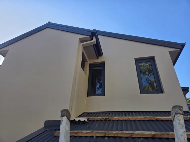 Newly painted render exterior and dark trims